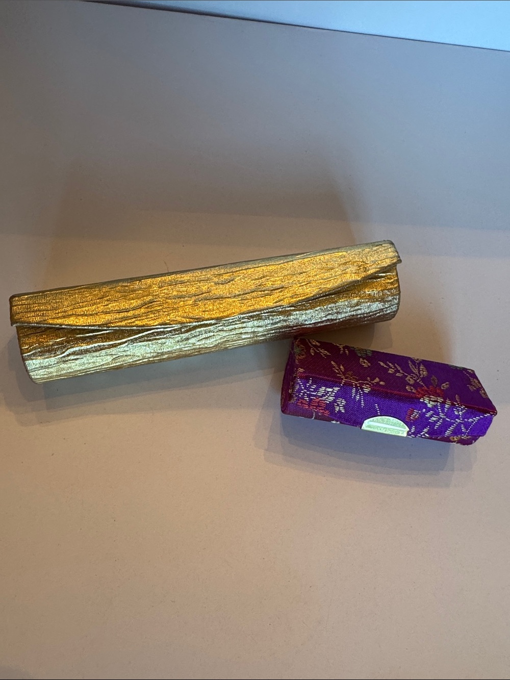Estee Lauder Gold lipstick holder and Purple Decorative Lipstick holder